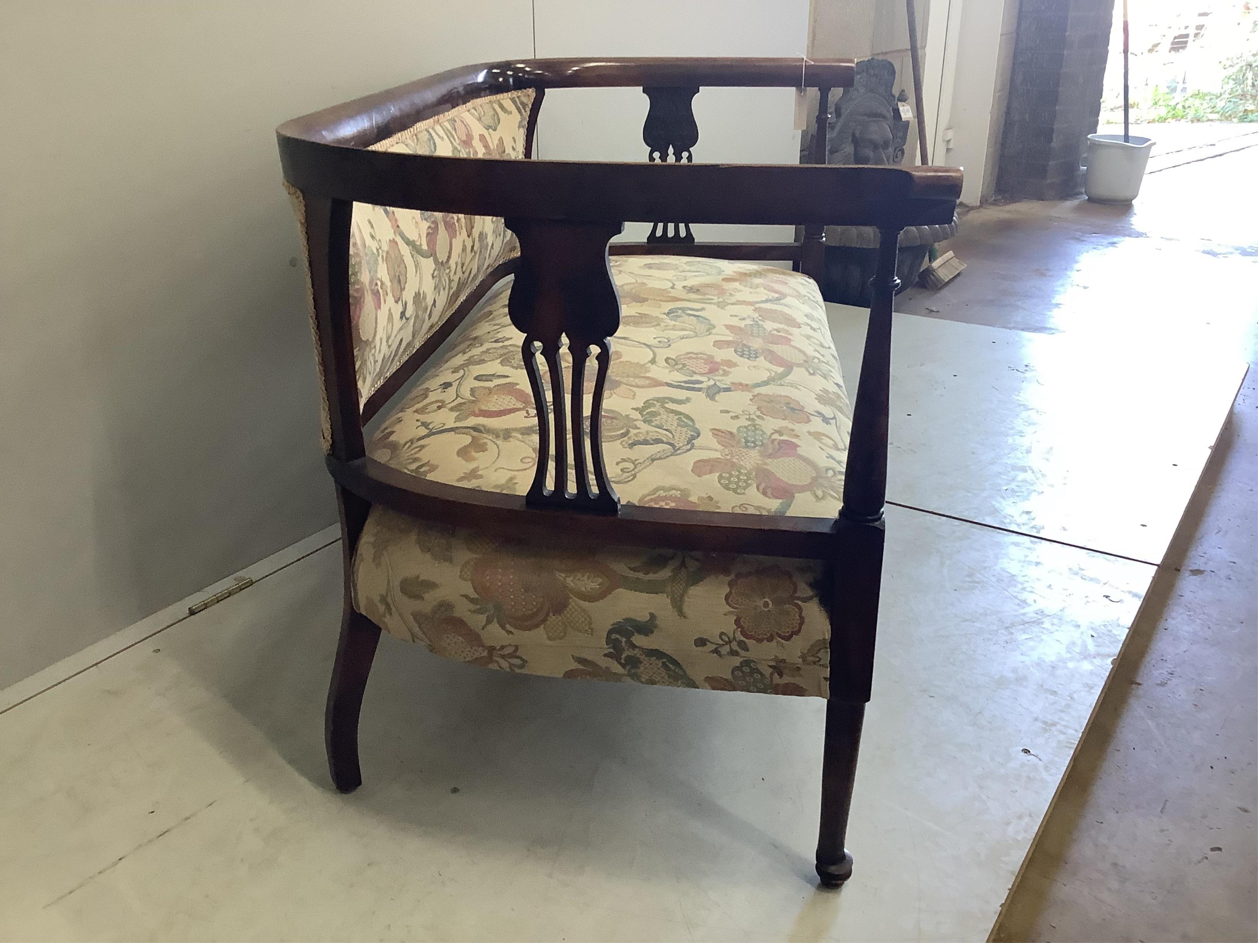 An Edwardian stained beech settee, width 122cm, height 73cm. Condition - fair